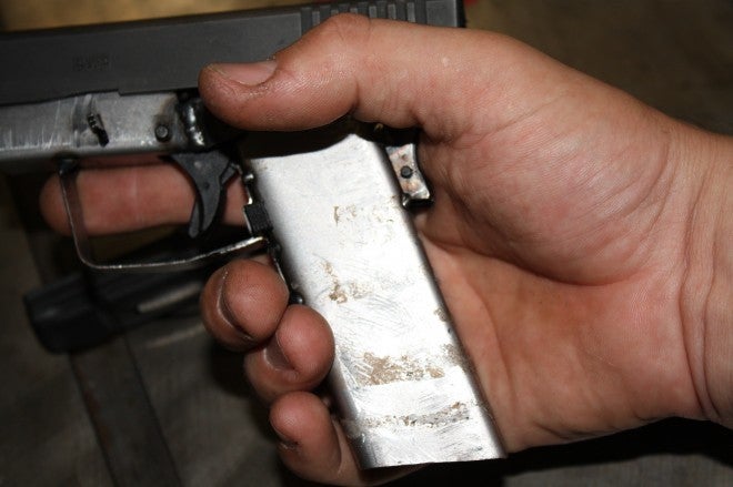 Grasping the iron frame you can see that there is a large void that's filled in an actual Glock