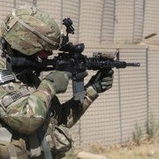 U.S._Army_Staff_Sgt._Chad_Hart,_an_adviser_with_the_10th_Mountain_Division,_fires_his_M4_carbine_downrange_at_Khair_Kot_Garrison,_Paktika_province,_Afghanistan,_June_6,_2013_130606-A-NQ567-063