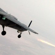 Iraq Airforce AC-208B fires Hellfire