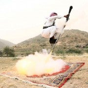 A man fires a weapon as he dances during a traditional excursion near Taif, Saudi Arabia August 8, 2015. Saudis usually participate in such excursions as they celebrate weddings or graduations. REUTERS/Mohamed Al Hwaity
