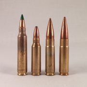 On the left are two .300 AAC Blackout rounds, alongside the green-tipped 5.56mm and shorter .221 Remington Fireball that serves as the round's parent case.