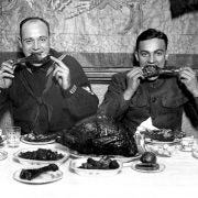 The best Thanksgiving ever? A US soldier and sailor both enjoy some turkey 17 days after the Armistice that ended the War to End All Wars.