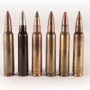 A lineup of 5.56mm rounds. The two on the right are Mk. 318 (second from right), and M855A1 (far right).