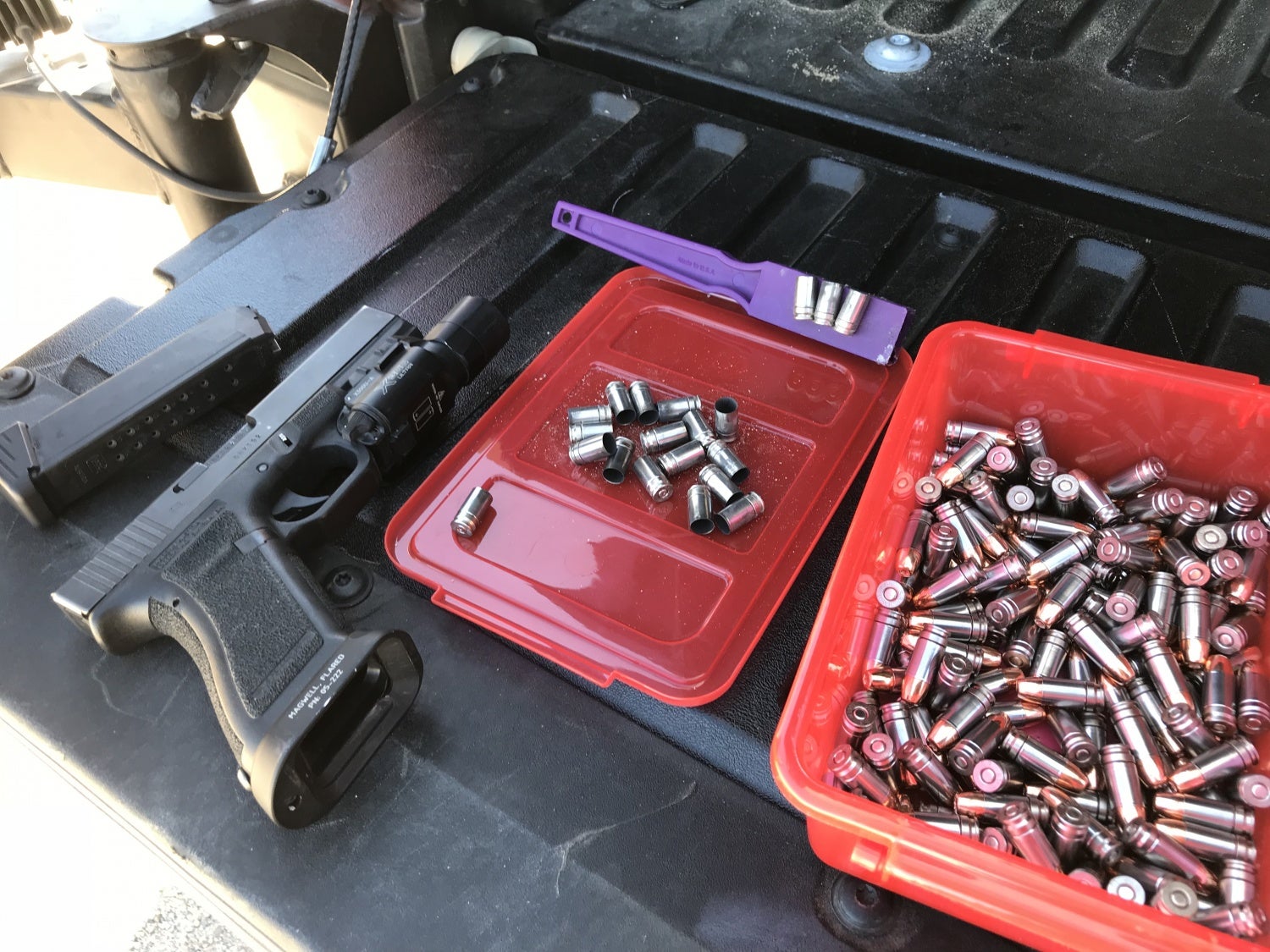 Spent NAS3 casings next to freshly loaded rounds. Note the purple magnet; these are very easy to pick up at the range.