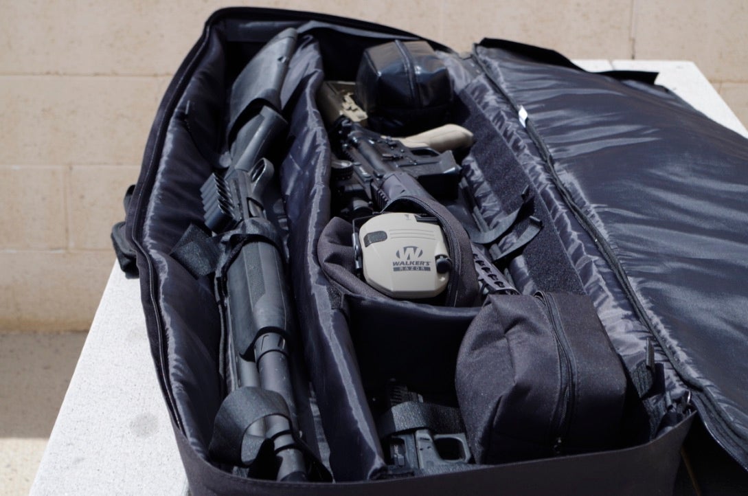 The 3GUN Softcase just swallows up guns. And it had like 400 feet of velcro strapping to anchor your long guns. If I had been a smarter monkey I would have stored the electronics in the waterproof pouch (at the rear)--but it's not like Phoenix ever gets rain.
