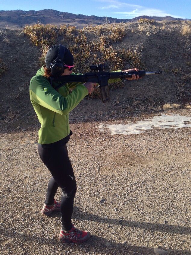 Quick Left Gun Club member takes aim using a AR-15 in .22LR.