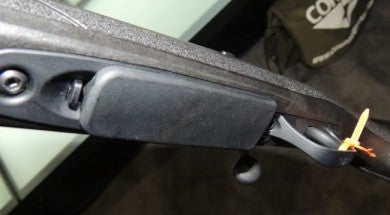 The detachable magazine inserts with a tactile and audible click, and the release lever is located in front of the magazine.