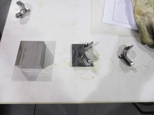 Everything starts out as a block of billet. In this case, you see grip safeties in various stages. 