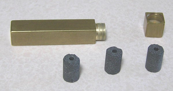 The power case and three blackpowder pellets.