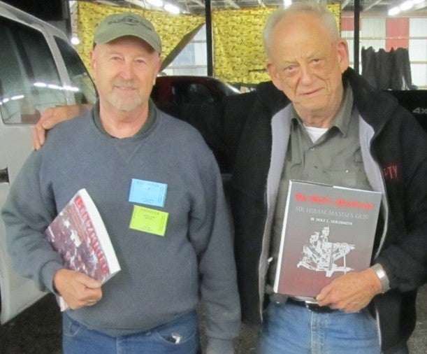 Frank Iannamico left, and Dolf Goldsmith right, holding their respective books. Goldsmith is a renowned 