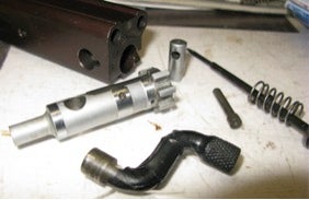  Detailed view of the bolt. Note the spring loaded firing pin, an option that is missing on the M-16.