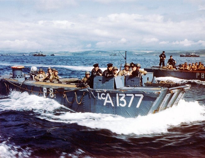 British Navy Landing Crafts (LCA-1377) carry United States Army Rangers to a ship near Weymouth in Southern England on June 1, 1944. British soldiers can be seen in the conning station. For safety measures, U.S. Rangers remained consigned on board English ships for five days prior to the invasion of Normandy, France.  (Photo by Galerie Bilderwelt/Getty Images)