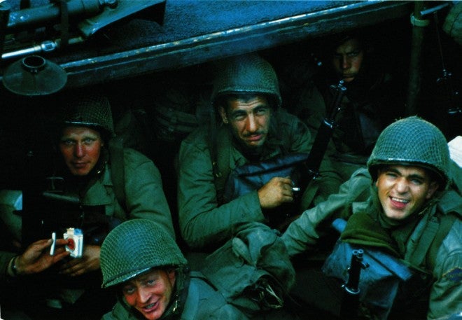 United States Rangers from E Company, 5th Ranger Battalion, on board a landing craft assault vessel (LCA) in Weymouth harbor, Dorset, on June 4, 1944. The ship is bound for the D-Day landing on Omaha Beach in Normandy. Clockwise, from far left: First Sergeant Sandy Martin, who was killed during the landing, Technician Fifth Grade Joseph Markovich, Corporal John Loshiavo and Private First Class Frank E. Lockwood. They are holding a 60mm mortar, a Bazooka, a Garand rifle and a pack of Lucky Strike cigarettes.  (Photo by Galerie Bilderwelt/Getty Images)
