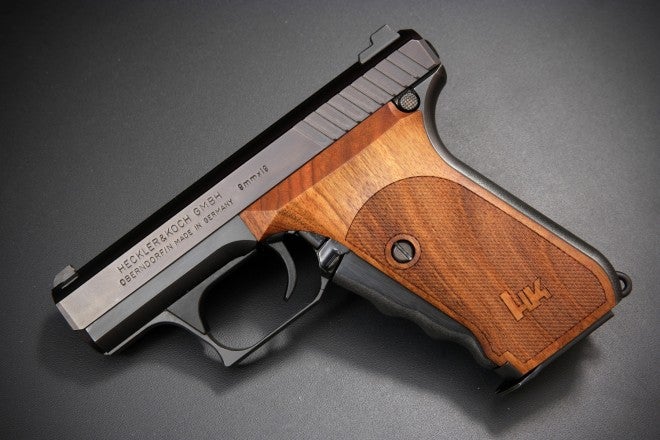 Side view of H&K P7 with wooden grips. 