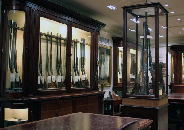 glass-encased-collectors-firearms-in-gun-room