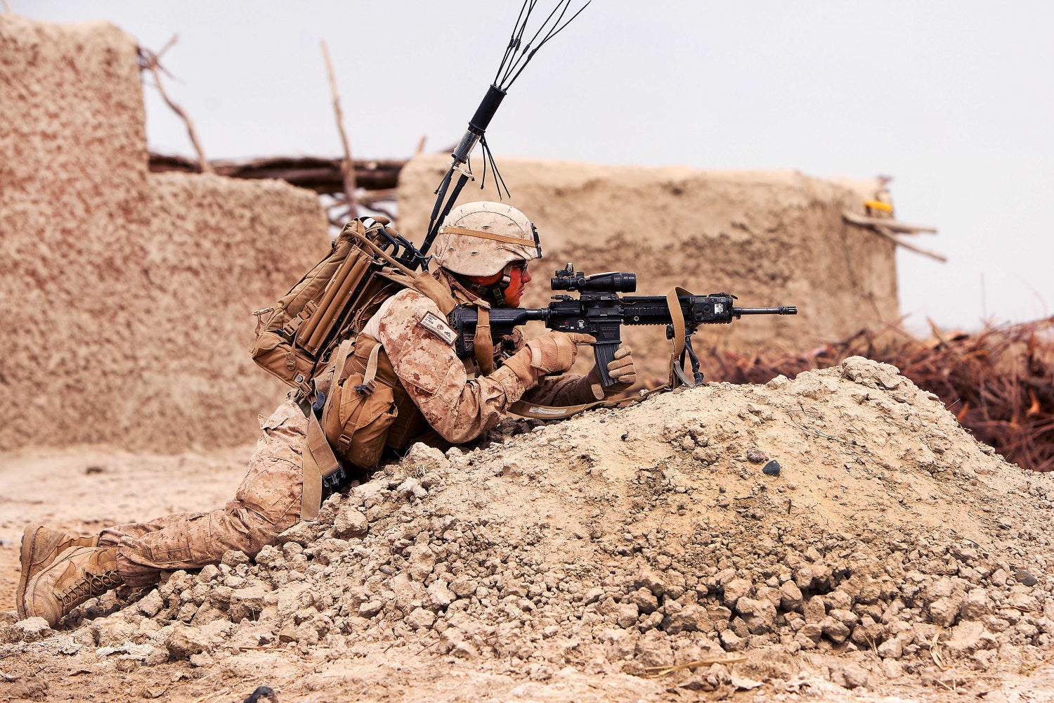 Defense.gov_News_Photo_120322-M-PH863-005_-_U.S._Marine_Corps_Lance_Cpl._Leobardo_Nunez_provides_security_during_a_census_patrol_through_a_village_near_Khan_Neshin_Afghanistan_on_March_22