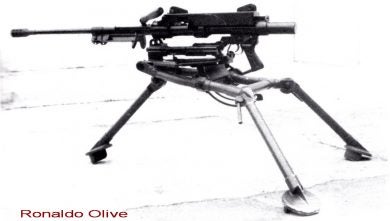 The gun, minus butt stock and with bipod folded, on a medium machine gun tripod mount.