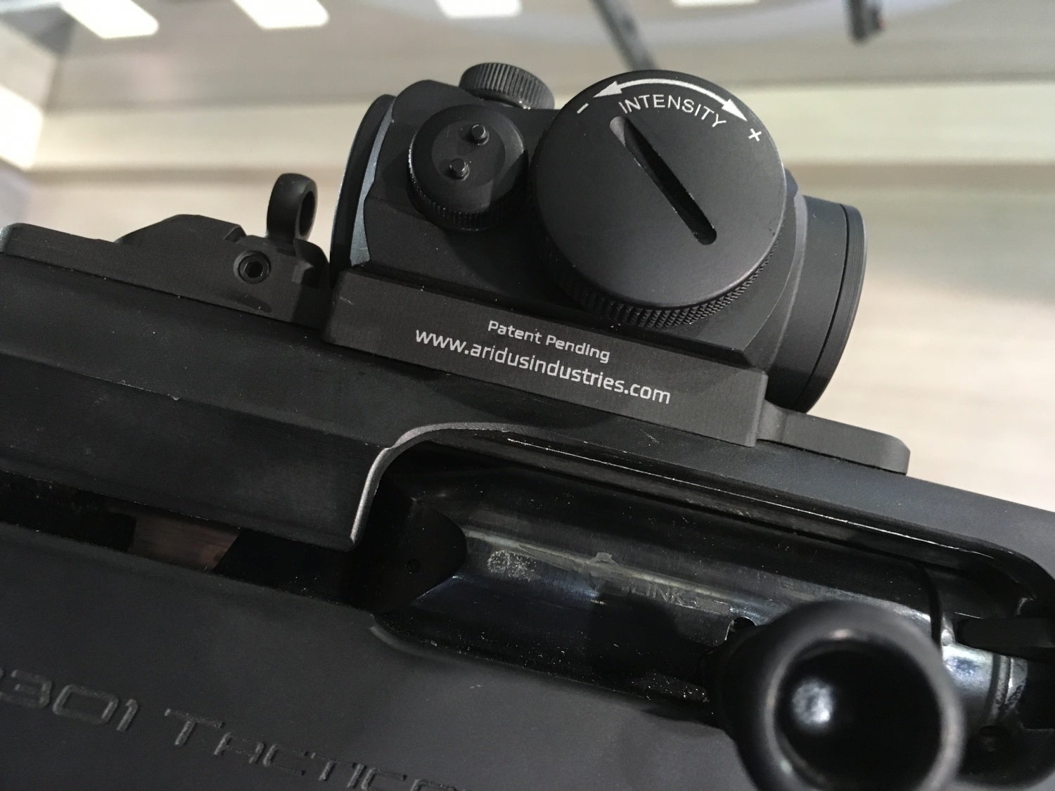 At the Beretta booth, I saw a Beretta Tactical 1301 with a distinct optic m...