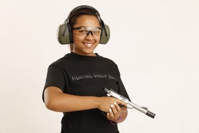 young girl with semi-auto pistol