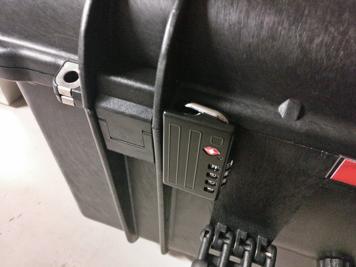 TSA compatible padlock affixed to a hasp