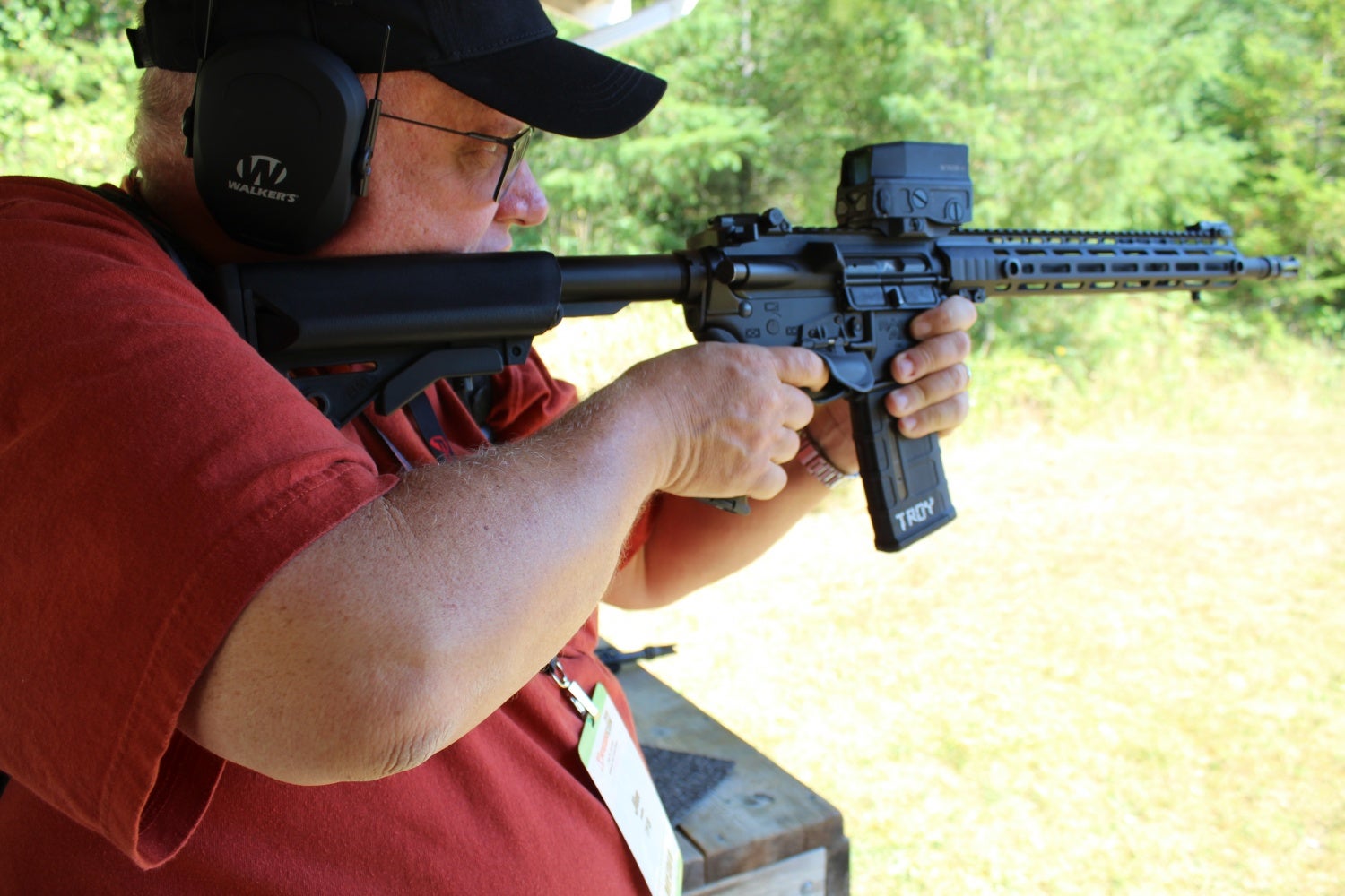 The author firing a rifle with the RTS Trigger Shield in place.