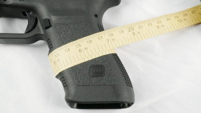 Glock 20SF grip measures 5 3/4” in circumference around the middle.