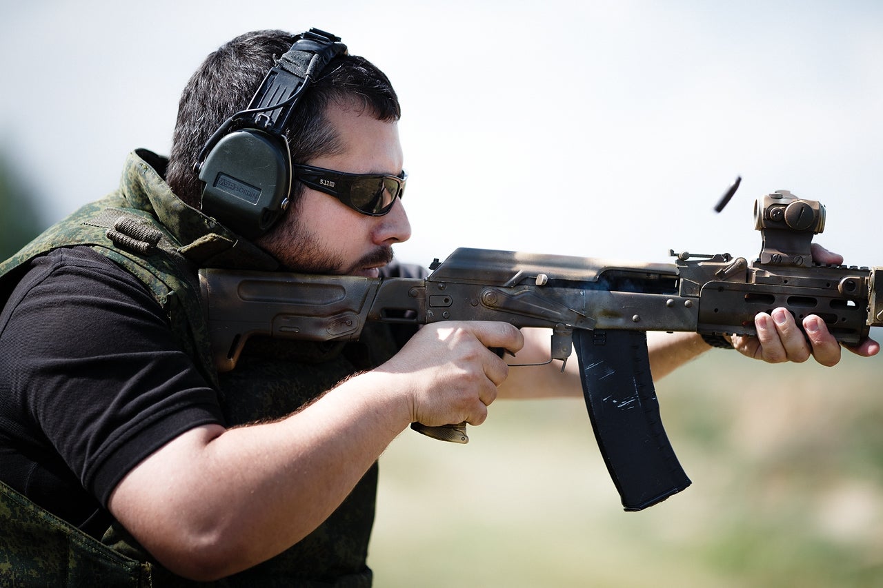 Author, shooting modified AK-74M with Aimpoint T-1 Micro mounted on the upper handguard. 