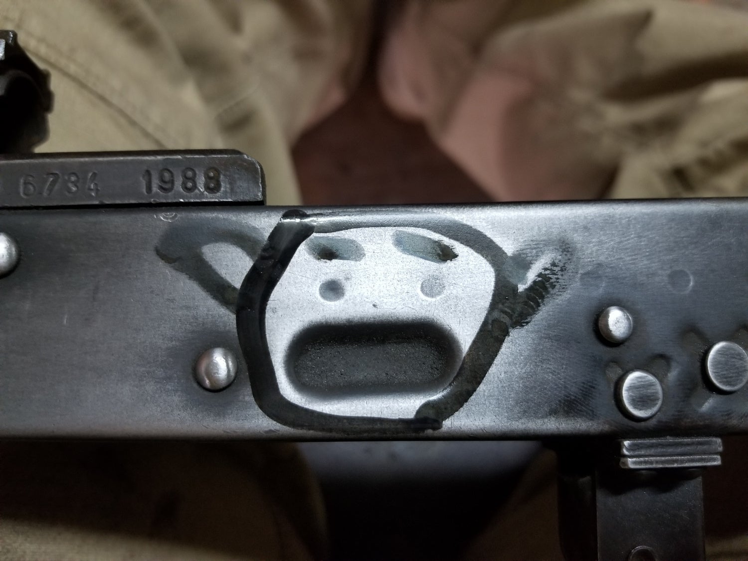 If you spend too much time around AKs you start to notice that magazine dimple looks like a face.