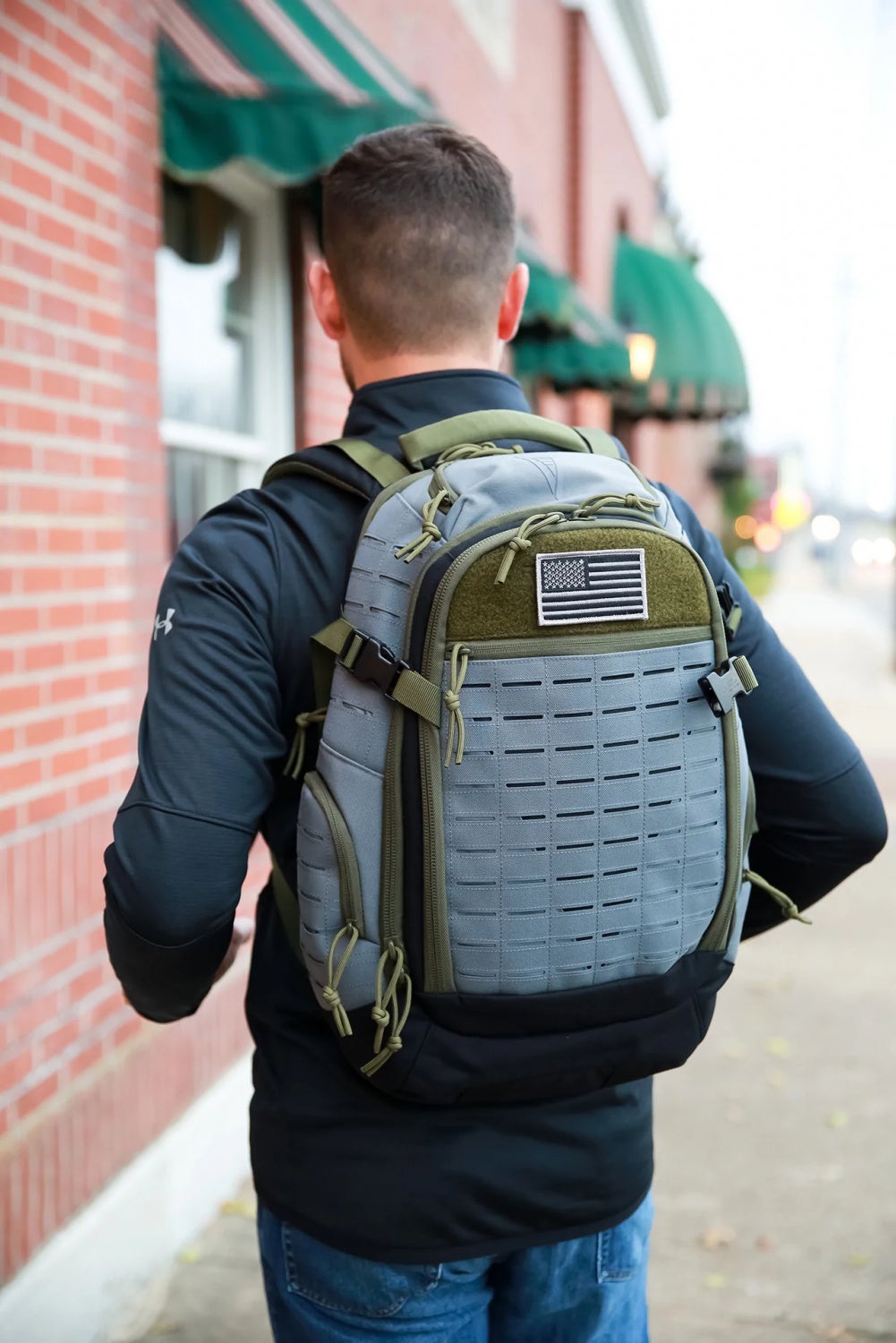 The Guardian EDC backpack is available in black, blue, tan, or multicolor "trifecta" as shown here.