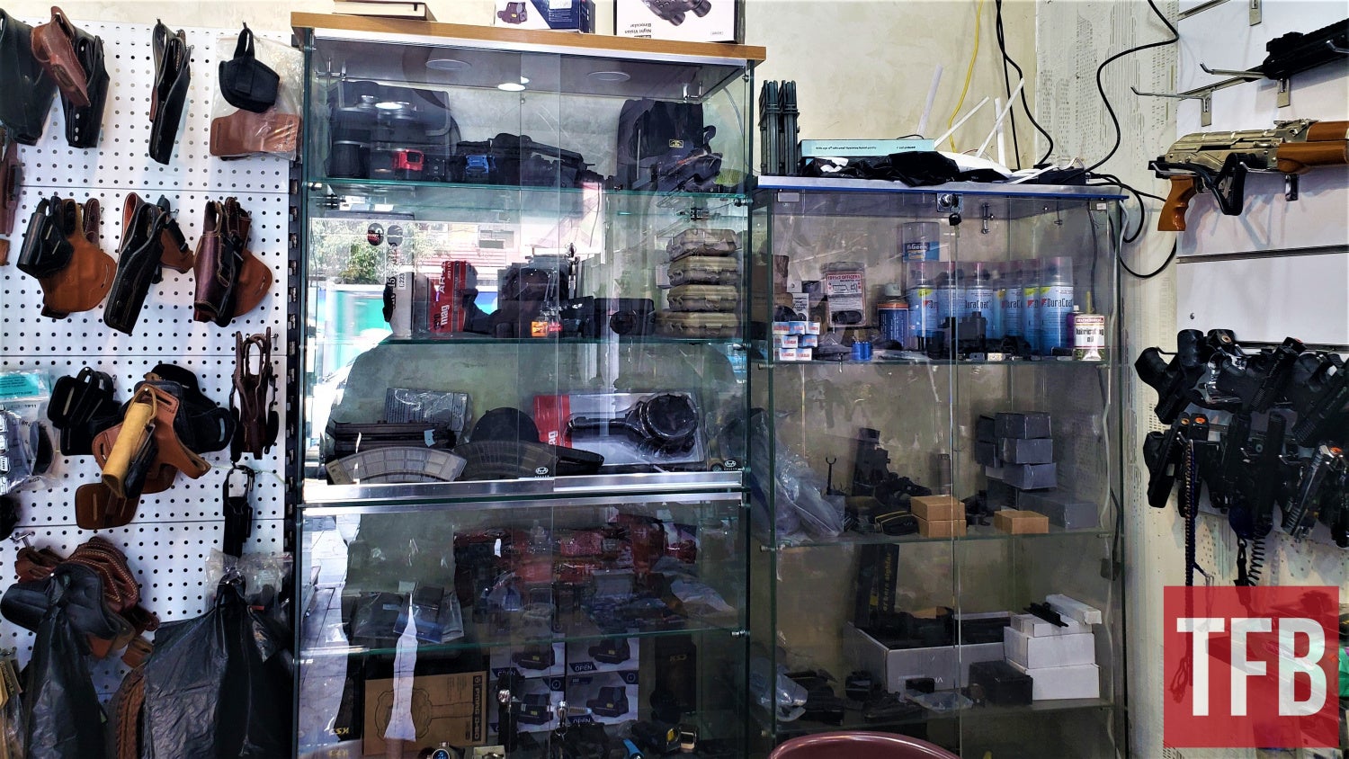 Only in Iraqi gun shop, you can see Duracoat next to an AK with gold or silver finish